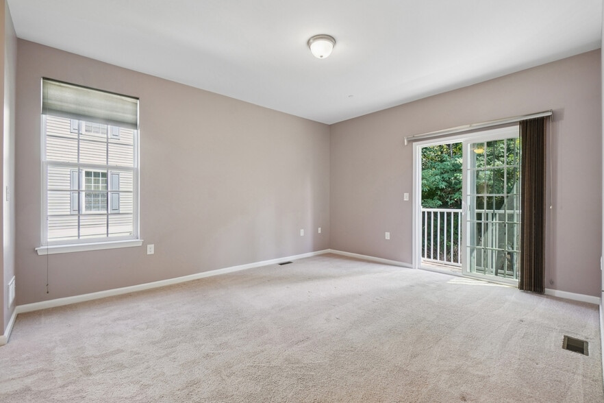 Primary Bedroom with Balcony - 401 Waterview Ct