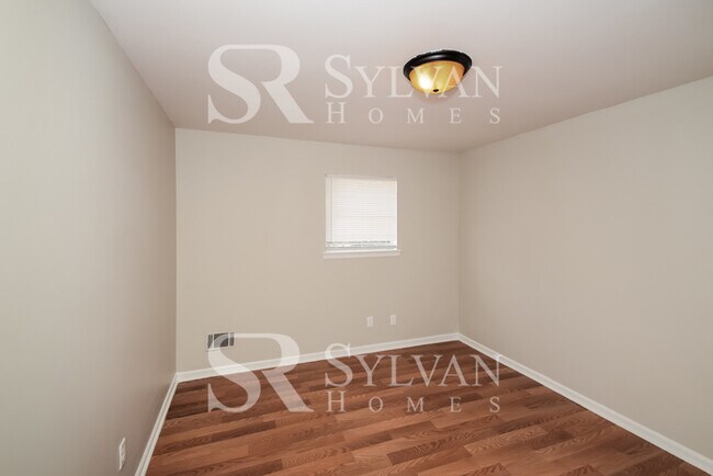 Building Photo - Welcome to this charming abode.