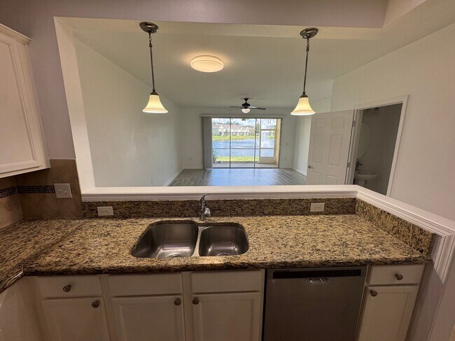 Building Photo - Lake Views. Upgraded Finishes. Gated Commu...
