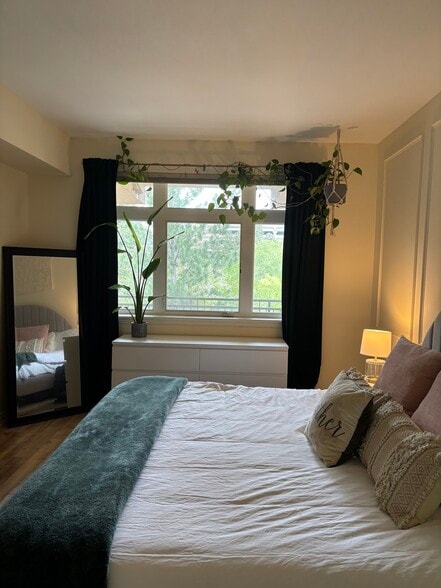 Bedroom with king sized bed. - 2700 E Cherry Creek South Dr