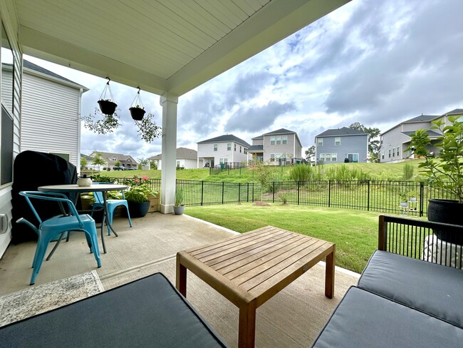 Covered patio with a fully fenced yard - 4111 Honey Locust Dr