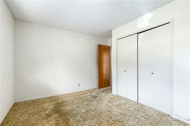 View of Bedroom 3 before new floors - 679 Rancho Dr