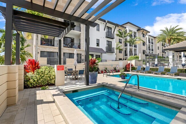 Building Photo - Luxury Living Meets Prime Location! Naples Square 2/2 Condo with Expansive Terrace