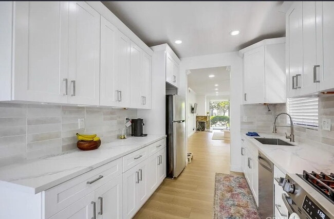 Building Photo - "Chic 1-Bedroom Retreat with Movie Room & ...