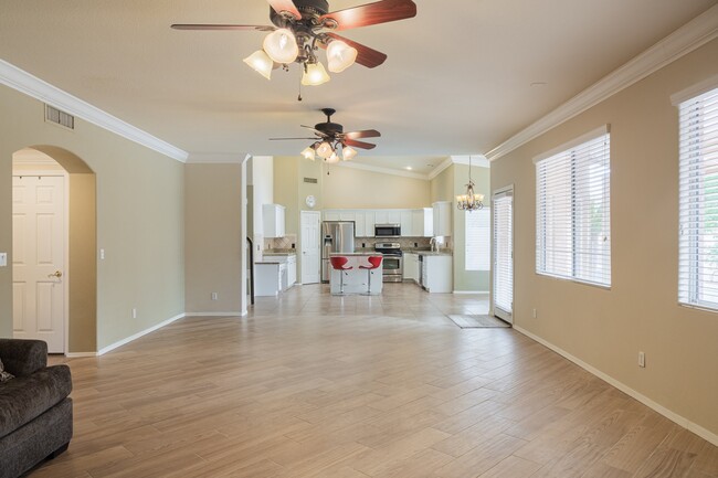 Family Room with Wood Burning Fireplace to Kitchen - 6901 E Evans Dr