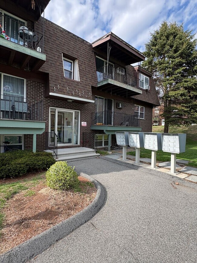 Building Photo - Rent reduced! Beautifully updated 2 bedroom condo, with 2 reserved parking spots, in Dracut MA