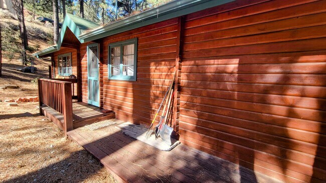 Building Photo - Move-In Ready 2-Bedroom Log Home with Wrap-Around Deck and Enclosed Yard