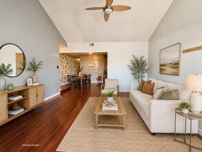 Building Photo - Top-Floor Plaza Condo with Vaulted Ceilings & Dual Balconies