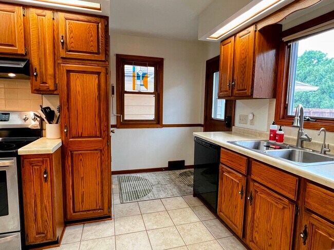 The backyard and deck as well as the basement are accessible from the kitchen. - 228 W Lexington Blvd