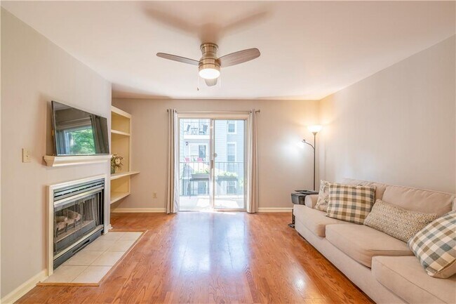 Living room with functioning fireplace - 305 Granville Ct