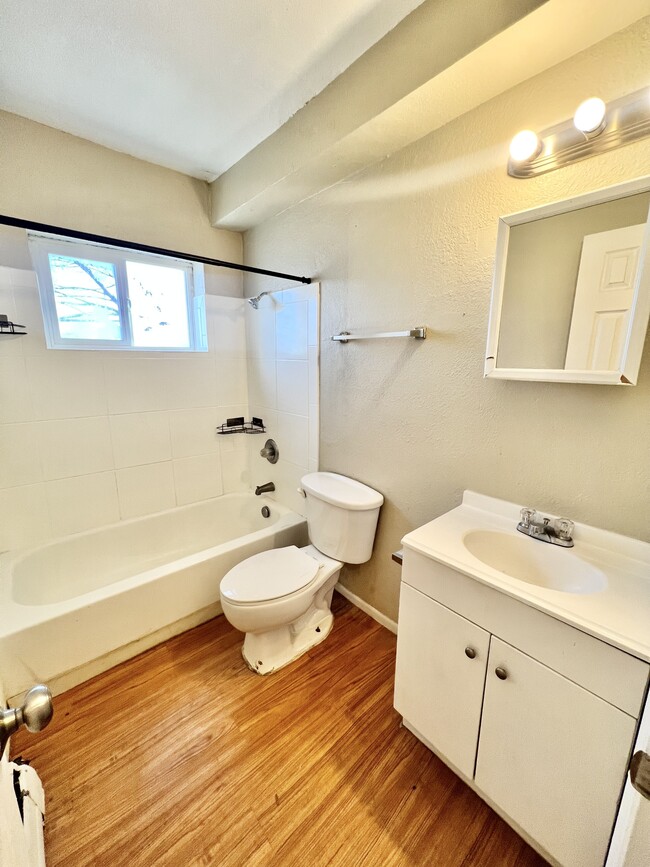 Experience a refreshing start to your day in this sleek and bright bathroom. - 1690 Eaton