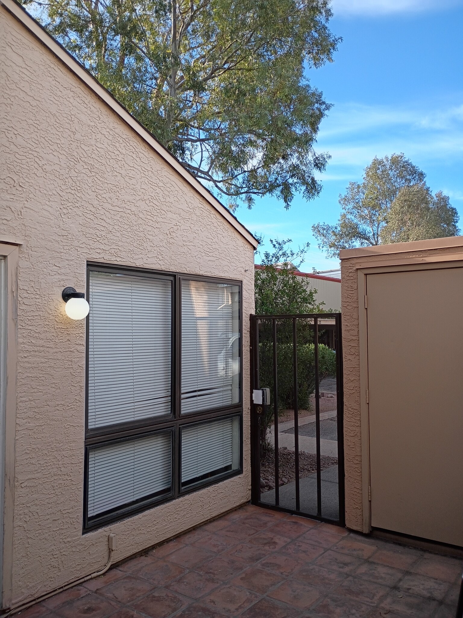 Gated entrance storage area living room window - 7618 E Callisto Cir