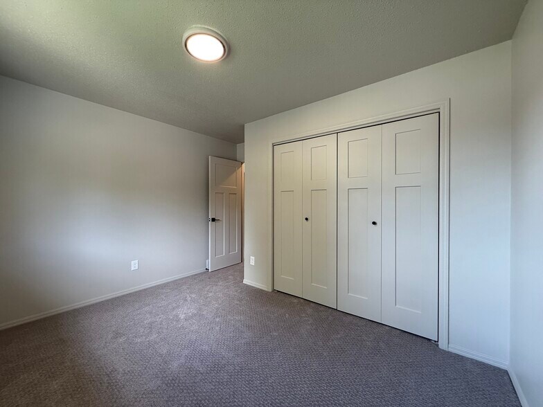 Upstairs bedroom #1 with four-panel doors - 2005 S Gordon Dr
