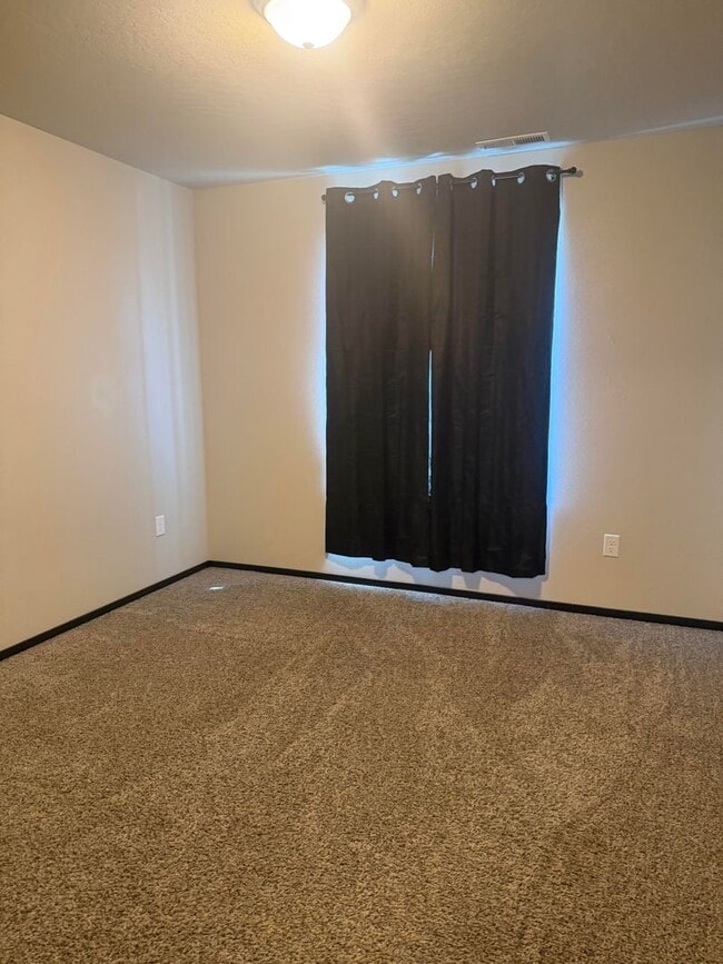 Building Photo - Lots of storage space in this 4- Car garage for all your playthings!!