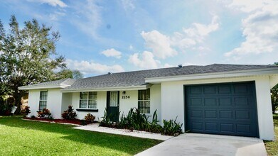 Building Photo - Waterfront 3BR Home on Canal | Spacious Yard | Lawn Care Included | Pet Friendly