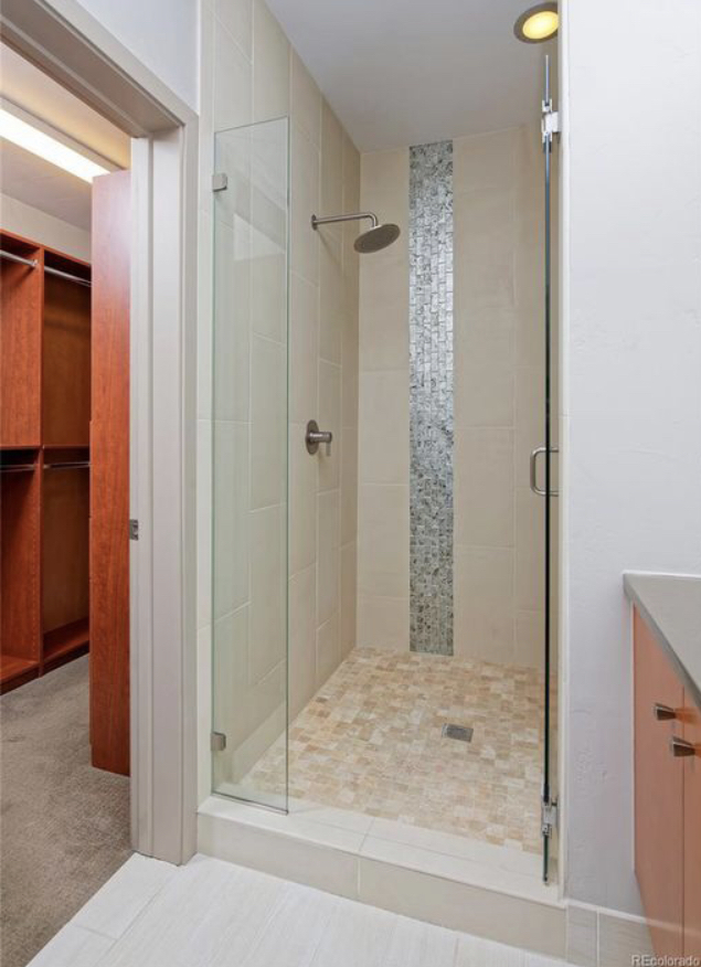 Primary en suite bathroom with shower and walk-in custom closet - 3211 Shoshone St