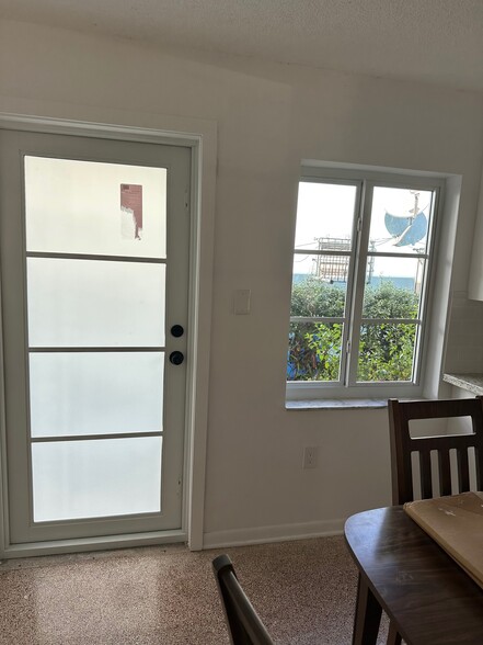 Dining area with door - 610 SW 6th Ave