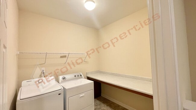 Building Photo - 3 Story Townhome 3 Bedrooms Rear Entry 2 Car Attached Garage with 1st Floor Bedroom, Community Po...