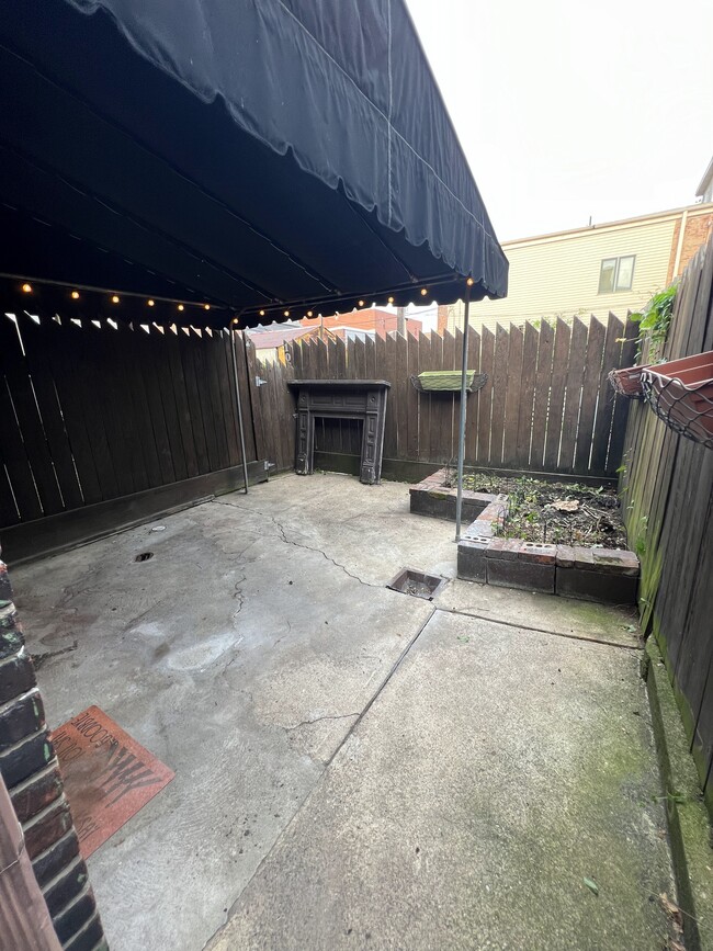 Backyard: private outdoor covered patio with lights - 103 S 22nd St