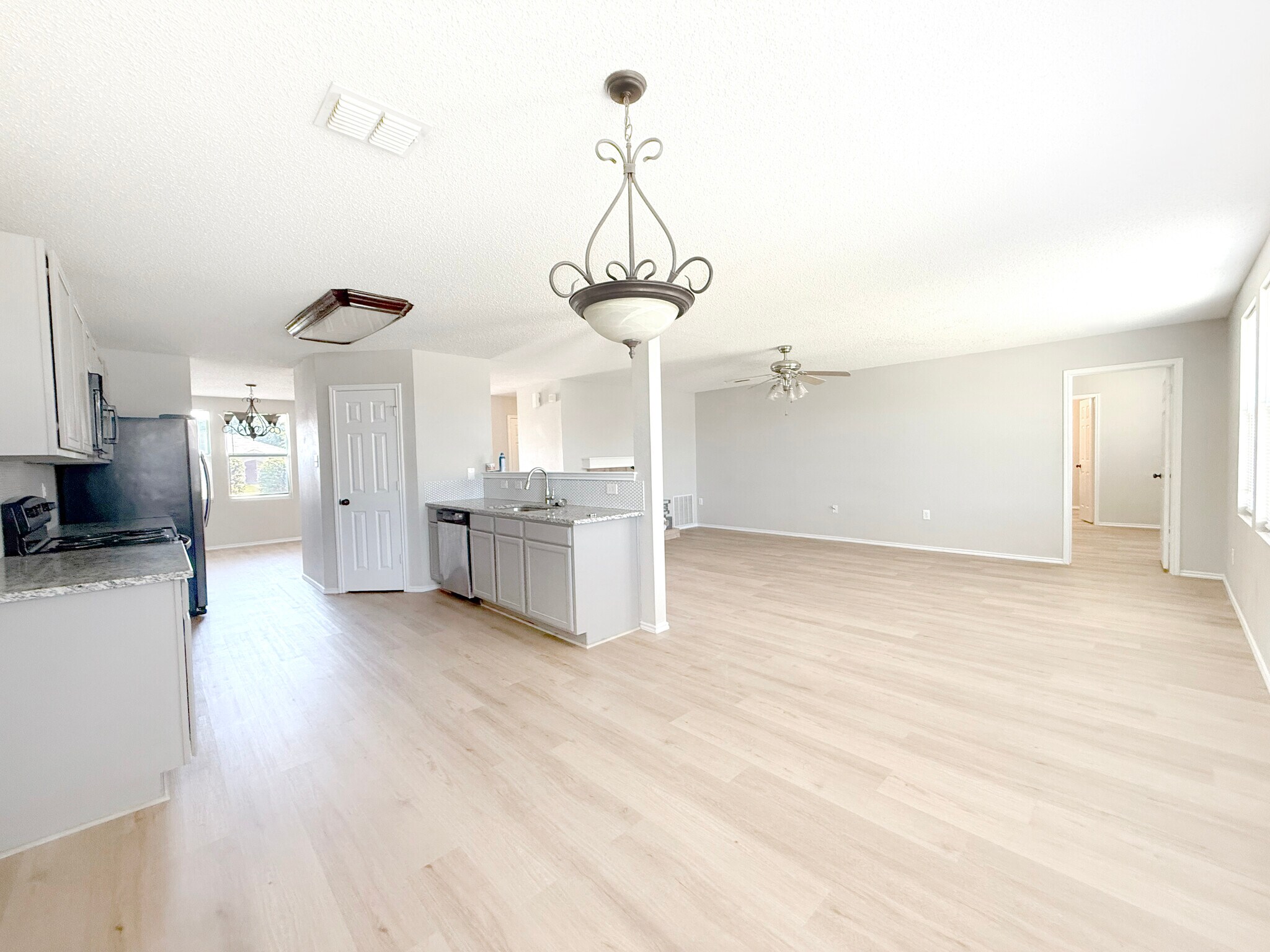 Eat-in looking through to formal dining and living. - 1419 Windy Meadows Dr