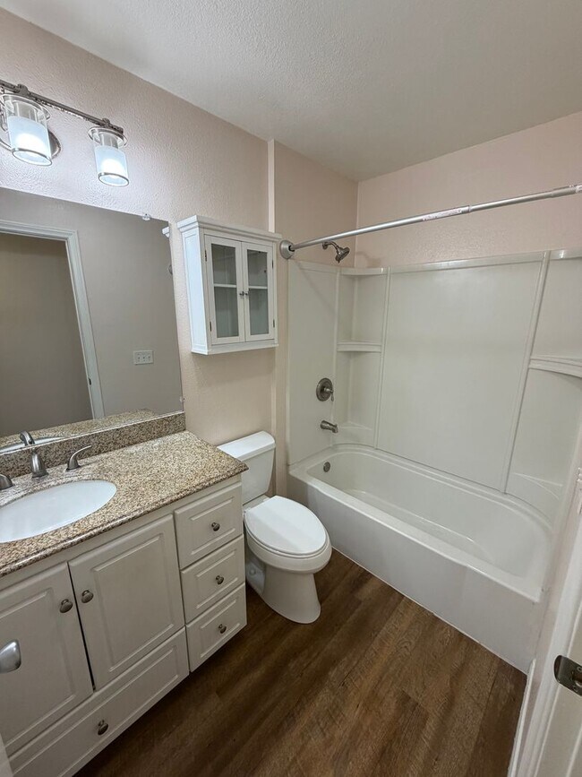 Building Photo - 2BR/1BA Lakeside ground floor condo with 1 car detached garage, 1 uncovered parking space & commu...