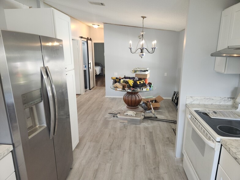 Kitchen looking into Dining Room - 4699 SE Bywood Ter