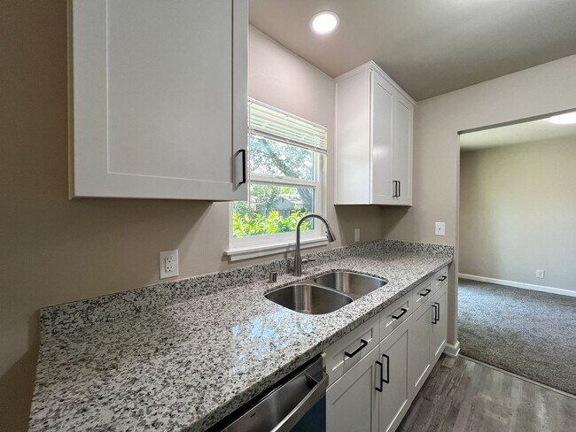 Building Photo - Freshly Renovated 3 Bedroom Home with Large Fenced Yard & Double Garage