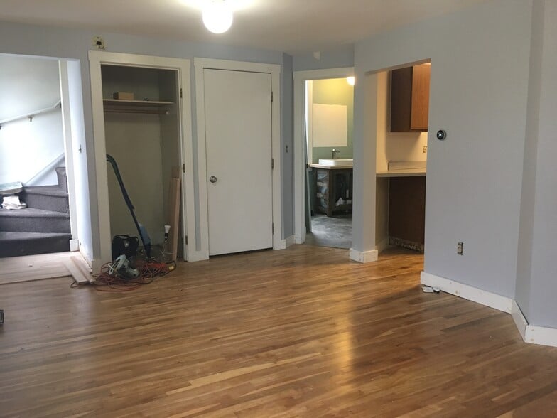 Living room looking toward kitchen/bath (and second egress). Please excuse the evidence of the final stages of renovation! - 12 Boynton Street
