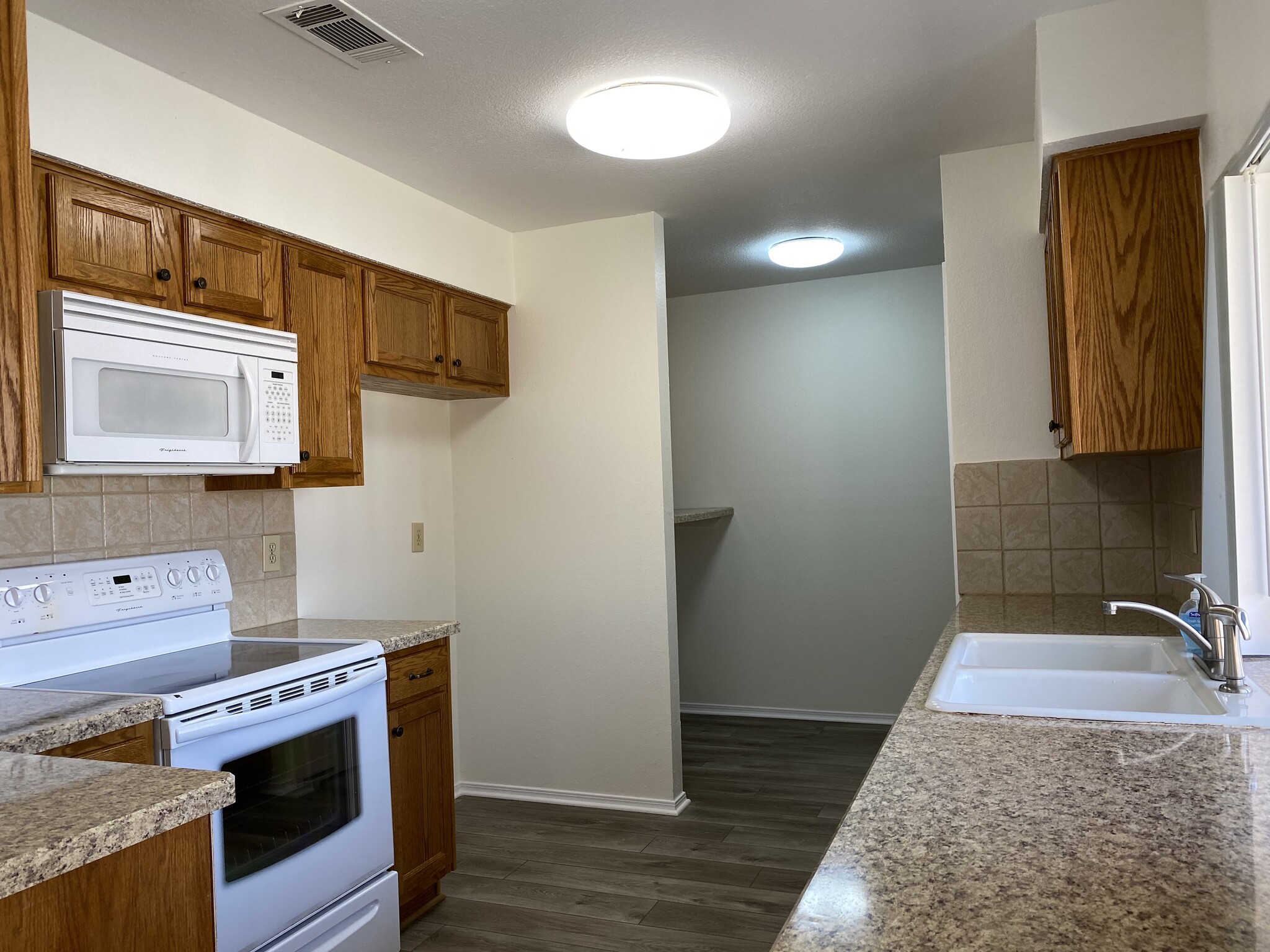 Kitchen and laundry area - 2429 Majestic Dr