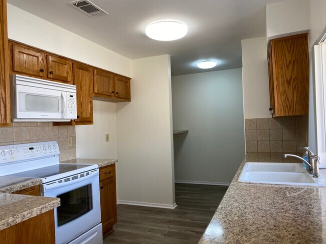 Kitchen and laundry area - 2429 Majestic Dr