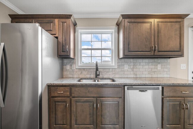 Building Photo - Spacious 4-Bedroom Home with Modern Upgrad...
