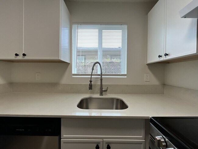 Building Photo - Inviting 2 Bedroom Home with Open Layout, Stainless Steel Appliances & Private Outdoor Retreat