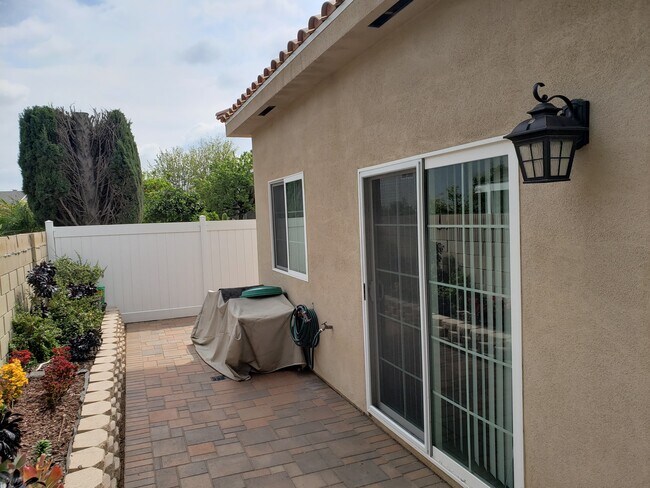 Back yard with patio door - 417 S Jennifer Ln