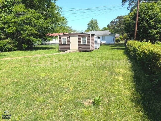 Building Photo - Updated Bungalow with Massive Deck and Fully Fenced Yard!