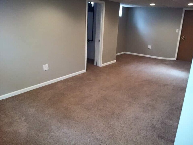 Basement living room and storage closet - 2616 S 48th Ave
