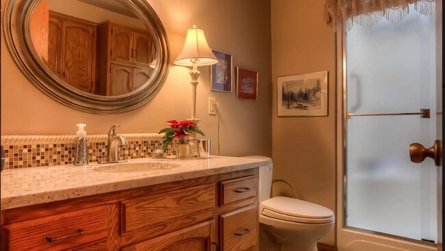 Building Photo - 4bd/3ba HUGE Home w/Hardwood Floors, Russian Fireplace, 2-Car Garage & Fenced Back Yard!