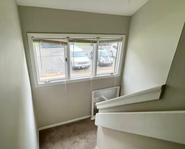 Upper stairwell looking into the parking area for the unit - 334 Shenandoah Cir