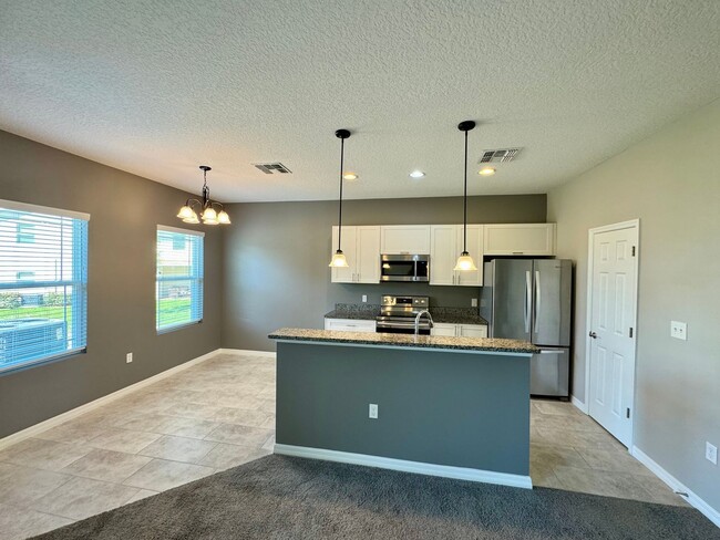 Building Photo - Move in ready 3/2 New Construction Townhou...