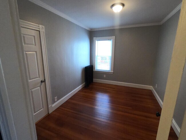 Back Right Bedroom (this photo is from the First Floor unit, which is identical minus the crown molding) - 11 Mt Vernon St
