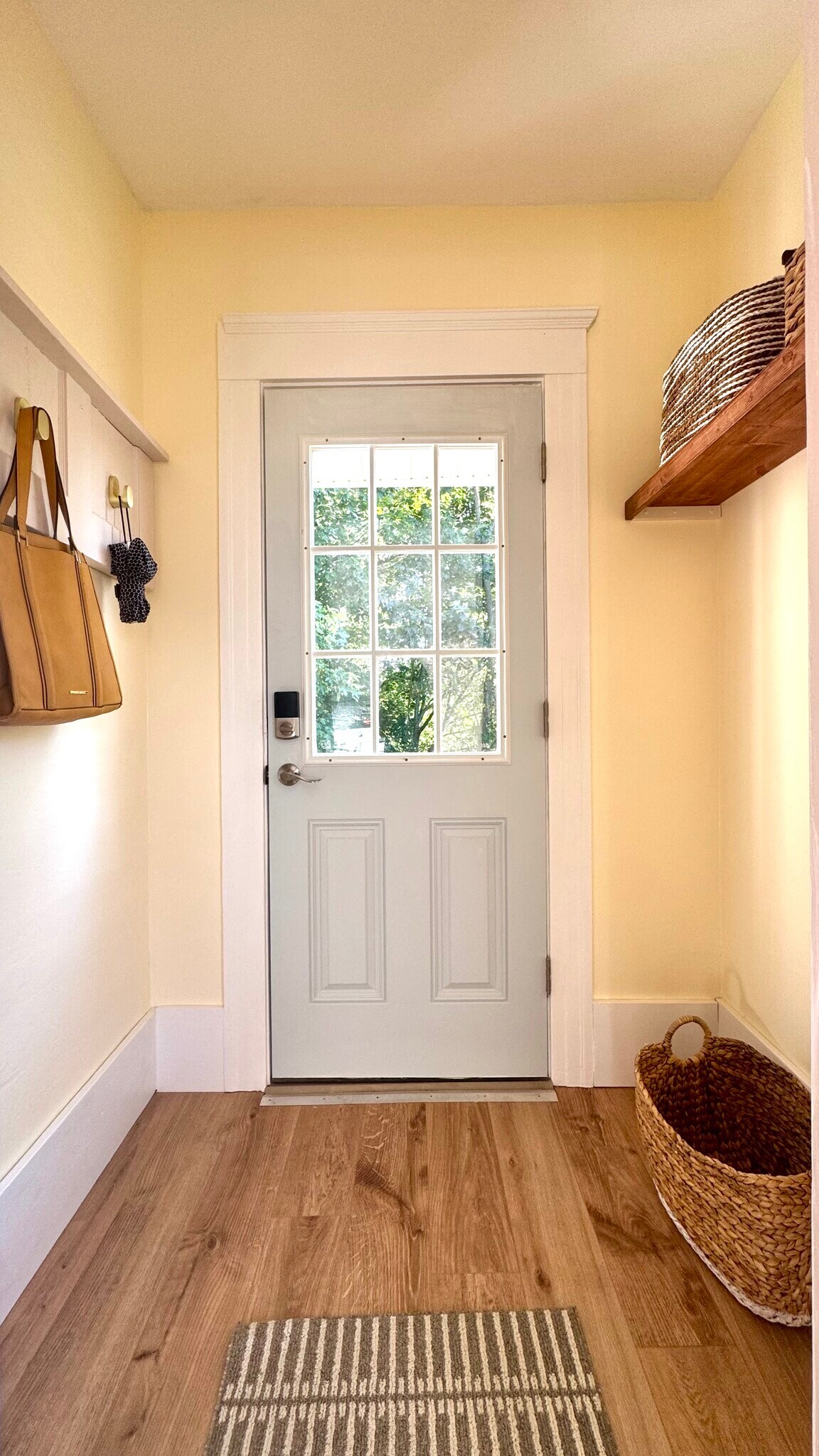 Refreshed, updated cozy mudroom entrance from the back porch. - 98 Maple St