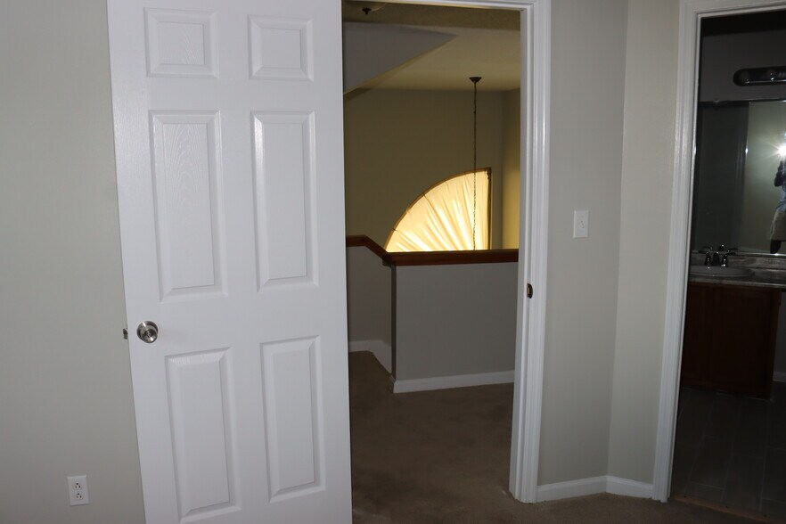 Upstairs Bedroom Fan looking into Dining Area. - 1057 Stones Throw Dr NW