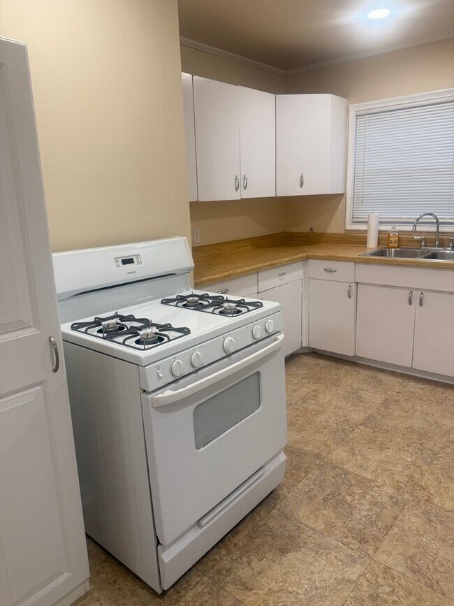 Building Photo - Step into this beautifully updated 1950's gem, where charm meets modern convenience