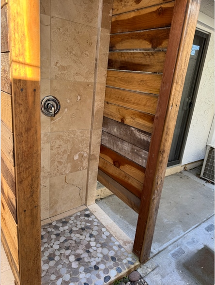 Outdoor shower with hot water and curtain rod - 140 Hueneme Ave