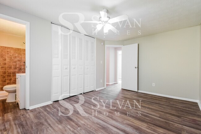 Building Photo - The living is easy in this 4 bedroom, 2 ba...