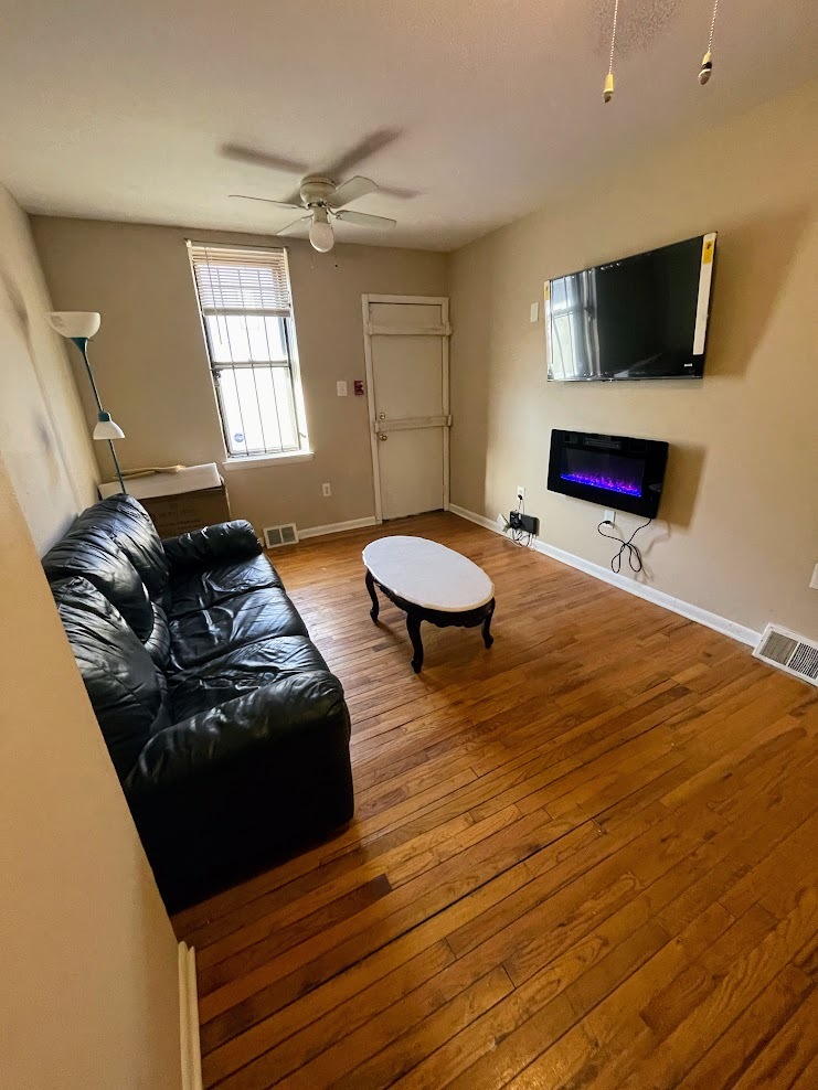 Apt 1 - Living Room w/ Fireplace and TV - 2148 N Carlisle St