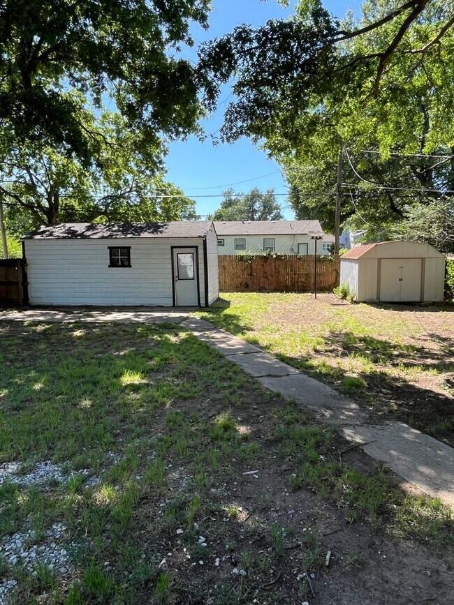 Building Photo - Step into this beautifully updated 1950's gem, where charm meets modern convenience