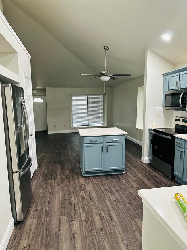 Updated kitchen with an open concept, island, appliances updated in 2023 - 627 Mountain Side Dr