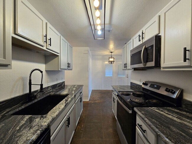 Building Photo - RENT REDUCTION - AVAILABLE NOW!