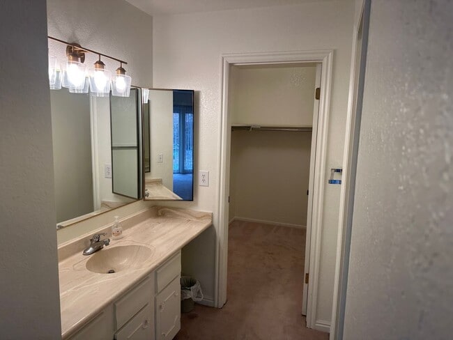 Building Photo - Spacious Millcreek Townhome with Two Living Areas, Private Deck & Community Amenities