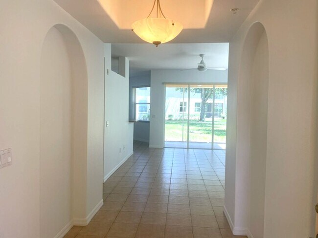 Building Photo - Elegant 3 Bedroom End-Unit Condo with Screened Lanai & Pond Views and A Private Garage